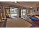 Living room with sliding doors leading to a pool at 189 Carlisle Nw Ave, Port Charlotte, FL 33952