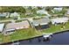 Aerial view of canal-front home with private pool and dock at 189 Carlisle Nw Ave, Port Charlotte, FL 33952