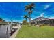 Waterfront property with private dock and lush landscaping at 189 Carlisle Nw Ave, Port Charlotte, FL 33952