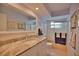 Clean bathroom with granite countertop, white cabinets, and a shower/tub combo at 189 Carlisle Nw Ave, Port Charlotte, FL 33952
