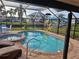 Enclosed pool and spa with canal views at 1933 Mississippi Ave, Englewood, FL 34224