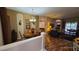Bright dining room with hardwood floors and views into the living room at 24412 Lakeview Pl, Punta Gorda, FL 33980