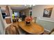 Spacious dining room featuring a rich wood table and hardwood floors at 24412 Lakeview Pl, Punta Gorda, FL 33980