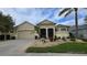 Attractive single-story home with a two-car garage and well-manicured landscaping at 24412 Lakeview Pl, Punta Gorda, FL 33980