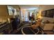 Comfortable living room with a fireplace and ample natural light at 24412 Lakeview Pl, Punta Gorda, FL 33980