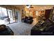 Relaxing living room featuring leather reclining furniture at 24412 Lakeview Pl, Punta Gorda, FL 33980