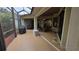 Relaxing screened porch with patio furniture and grill at 24412 Lakeview Pl, Punta Gorda, FL 33980