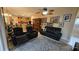 Spacious living room with comfortable seating and access to the patio at 24412 Lakeview Pl, Punta Gorda, FL 33980