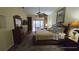 Large main bedroom with a king-size bed and access to the backyard at 24412 Lakeview Pl, Punta Gorda, FL 33980