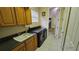 Convenient laundry room with washer, dryer, and utility sink at 24412 Lakeview Pl, Punta Gorda, FL 33980