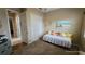 Versatile bedroom with daybed and access to a private patio at 24412 Lakeview Pl, Punta Gorda, FL 33980