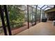 Relaxing screened patio with access to backyard landscaping at 24412 Lakeview Pl, Punta Gorda, FL 33980