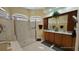 Primary bathroom with double vanity, shower, and garden tub at 24412 Lakeview Pl, Punta Gorda, FL 33980