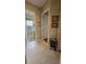 Bright hallway with tile flooring, access to bathroom and other rooms at 24412 Lakeview Pl, Punta Gorda, FL 33980