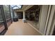 Spacious screened patio with grill and seating area at 24412 Lakeview Pl, Punta Gorda, FL 33980