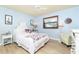 Guest bedroom with a full-size bed and light blue walls at 3075 Bay Oaks Cir, Englewood, FL 34223
