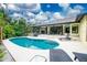 Enjoy the Florida sunshine by the pool at 3075 Bay Oaks Cir, Englewood, FL 34223