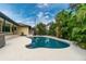 Inviting kidney-shaped pool, perfect for relaxation at 3075 Bay Oaks Cir, Englewood, FL 34223