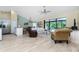 Bright living room with comfy seating and access to pool at 3075 Bay Oaks Cir, Englewood, FL 34223