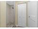Bathroom with walk-in shower and built in shelving at 3075 Bay Oaks Cir, Englewood, FL 34223