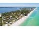 Aerial view showcasing a home's location with direct beach access at 3075 Bay Oaks Cir, Englewood, FL 34223