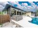 Home features a large pool and hot tub at 3075 Bay Oaks Cir, Englewood, FL 34223