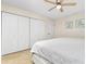 Bedroom with a queen-size bed and ample closet space at 3075 Bay Oaks Cir, Englewood, FL 34223