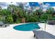 Relaxing pool and patio area with lounge chairs at 3075 Bay Oaks Cir, Englewood, FL 34223