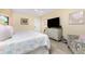 Bedroom with a queen-size bed and dresser at 3075 Bay Oaks Cir, Englewood, FL 34223