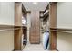Large walk-in closet with ample shelving and hanging space at 3075 Bay Oaks Cir, Englewood, FL 34223