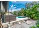 Relaxing pool and hot tub with ample space for lounging at 3075 Bay Oaks Cir, Englewood, FL 34223