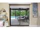 View of the private pool and patio from the sliding glass doors at 3075 Bay Oaks Cir, Englewood, FL 34223