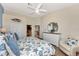 Bright bedroom with king-size bed and access to bathroom at 3393 Grand Vista Ct # 201, Port Charlotte, FL 33953