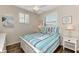 Charming bedroom with a queen-size bed and window at 3393 Grand Vista Ct # 201, Port Charlotte, FL 33953