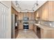 Updated kitchen featuring stainless steel appliances and tile backsplash at 3393 Grand Vista Ct # 201, Port Charlotte, FL 33953