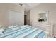 Serene bedroom with dresser, queen-size bed, and closet at 3393 Grand Vista Ct # 201, Port Charlotte, FL 33953
