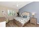Main bedroom with large bed, dresser, and water views at 3393 Grand Vista Ct # 201, Port Charlotte, FL 33953