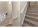 View of carpeted staircase and entryway at 3393 Grand Vista Ct # 201, Port Charlotte, FL 33953