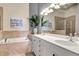 Elegant bathroom with double vanity, soaking tub, and shower at 3393 Grand Vista Ct # 201, Port Charlotte, FL 33953