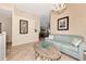 Upper level sitting area with sofas and a tiled floor at 3393 Grand Vista Ct # 201, Port Charlotte, FL 33953