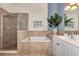 Spa-like bathroom featuring a shower and a soaking tub at 3393 Grand Vista Ct # 201, Port Charlotte, FL 33953