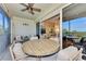Spacious screened balcony with partial view of living area and preserve at 3393 Grand Vista Ct # 201, Port Charlotte, FL 33953