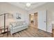 Comfortable bedroom with sofa and access to other rooms at 3393 Grand Vista Ct # 201, Port Charlotte, FL 33953