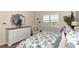 Main bedroom with king-size bed and dresser; serene atmosphere at 3393 Grand Vista Ct # 201, Port Charlotte, FL 33953