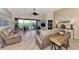 Spacious living room with access to a balcony and bedroom at 3393 Grand Vista Ct # 201, Port Charlotte, FL 33953