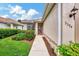 Inviting home exterior with landscaped walkway leading to the front door at 3394 Osprey Ln, Port Charlotte, FL 33953