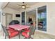 Covered patio with table, chairs, and access to the interior at 3394 Osprey Ln, Port Charlotte, FL 33953