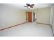 Bright bedroom with ceiling fan and access to another room at 412 Cypress Forest Dr, Englewood, FL 34223