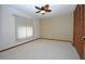 Bright bedroom with ceiling fan and spacious closet at 412 Cypress Forest Dr, Englewood, FL 34223
