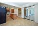 Kitchen with island, wood cabinets, and view into living area at 412 Cypress Forest Dr, Englewood, FL 34223